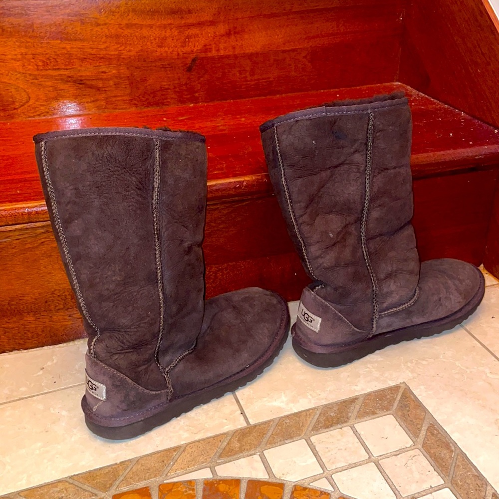 Brown pair of tall Ugg boots.